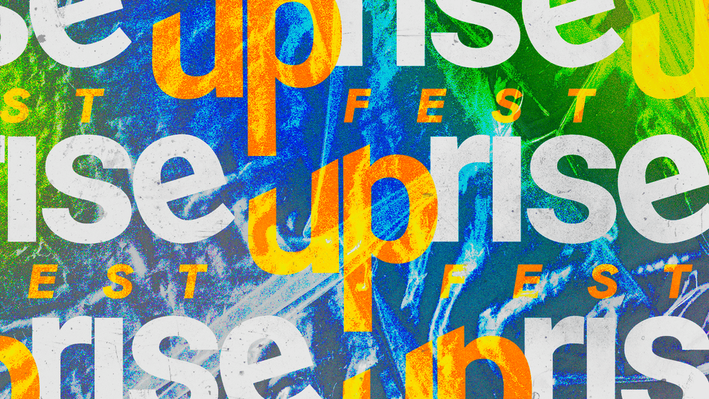 Uprise Fest key art: the uprise wordmark repeated in white, orange and yellow over a blue and green concert photo